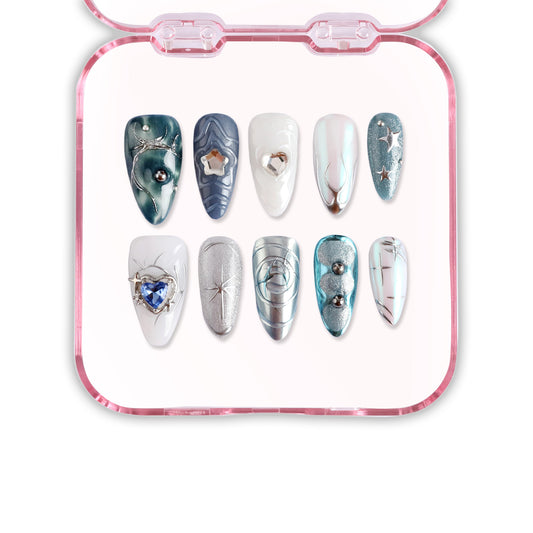 Set of decorative nail art sheets with various designs on a pink tray.